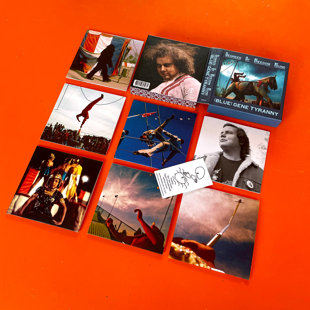 Deluxe CD box set for "Blue" Gene Tyranny - Degrees of Freedom Found, showing eight disc sleeves with colorful photographs and liner notes