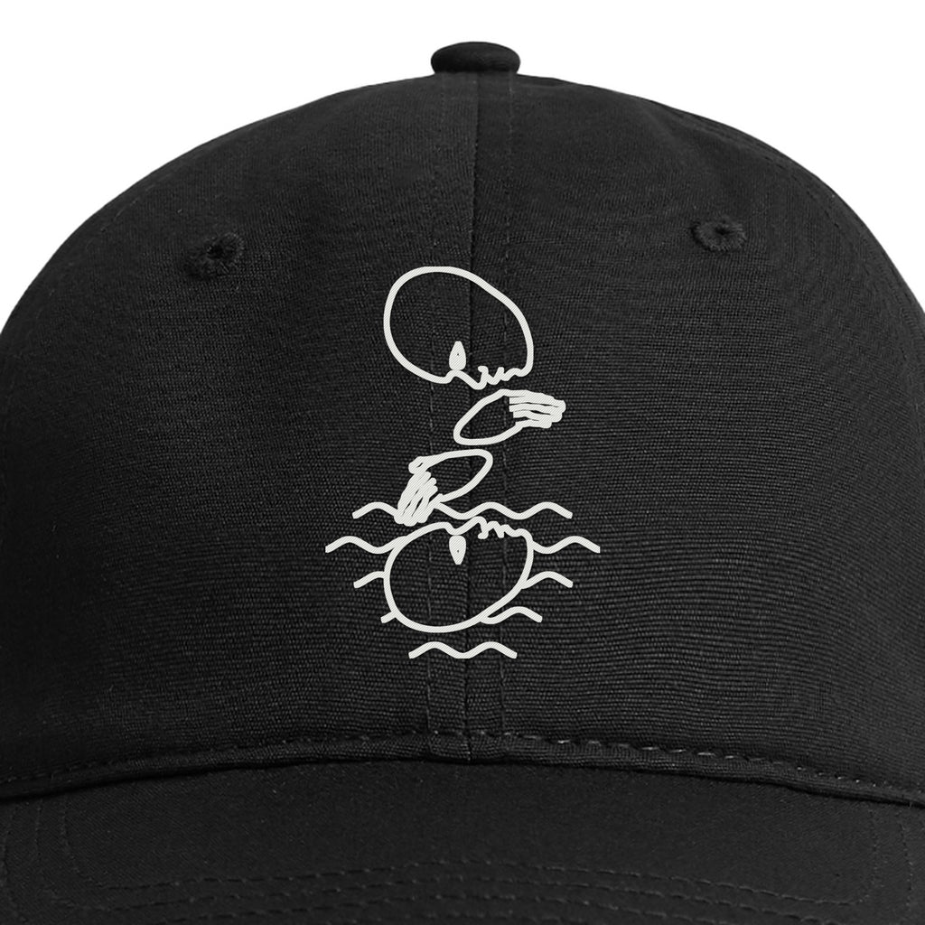 Close-up of the white embroidered Mystery Logo on the front of the black cap