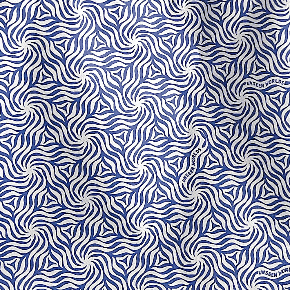 Close-up of the Unseen Worlds pattern printed on the tote, showing the wordmark worked into the design
